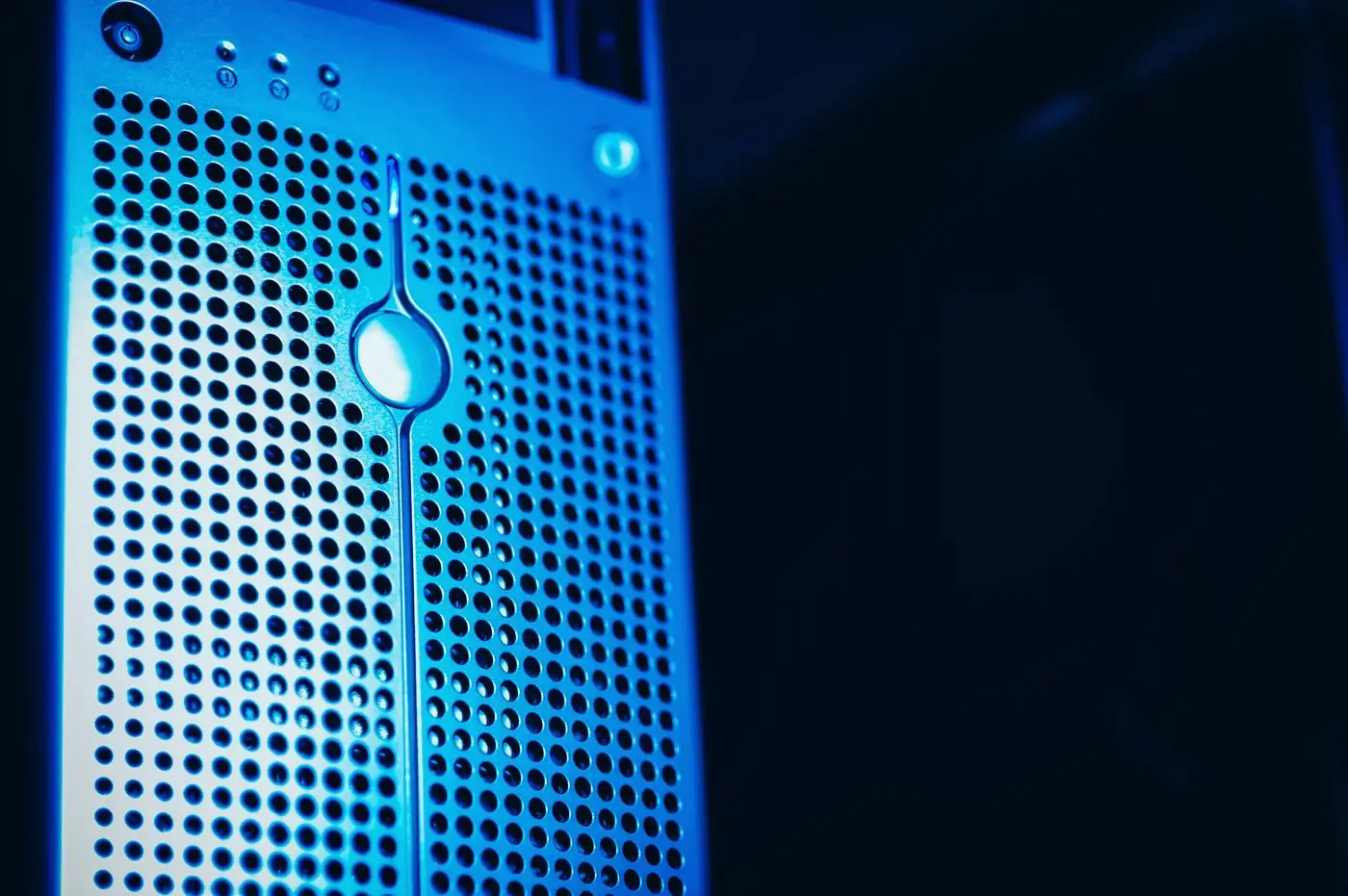 Close view of a server in a data center lit in blue